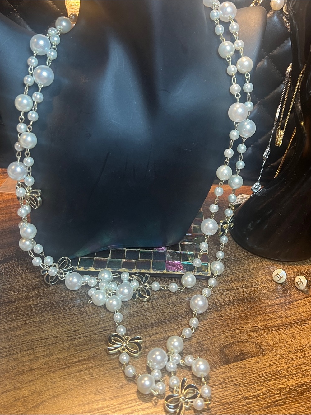 Ivory Faux Pearl Multi-Strand Necklace with Gold Bow Accents